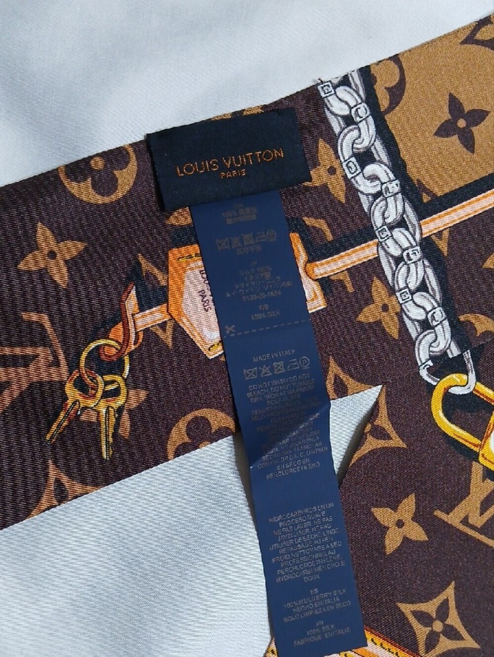 Louis Vuitton Brown & Tan Monogram Silk Twilly with Equestrian Chain Motif - Picture 3 of 3